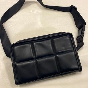 Never used faux leather black rectangular fanny pack